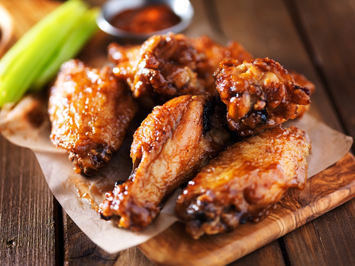 chicken wings and celery on plate