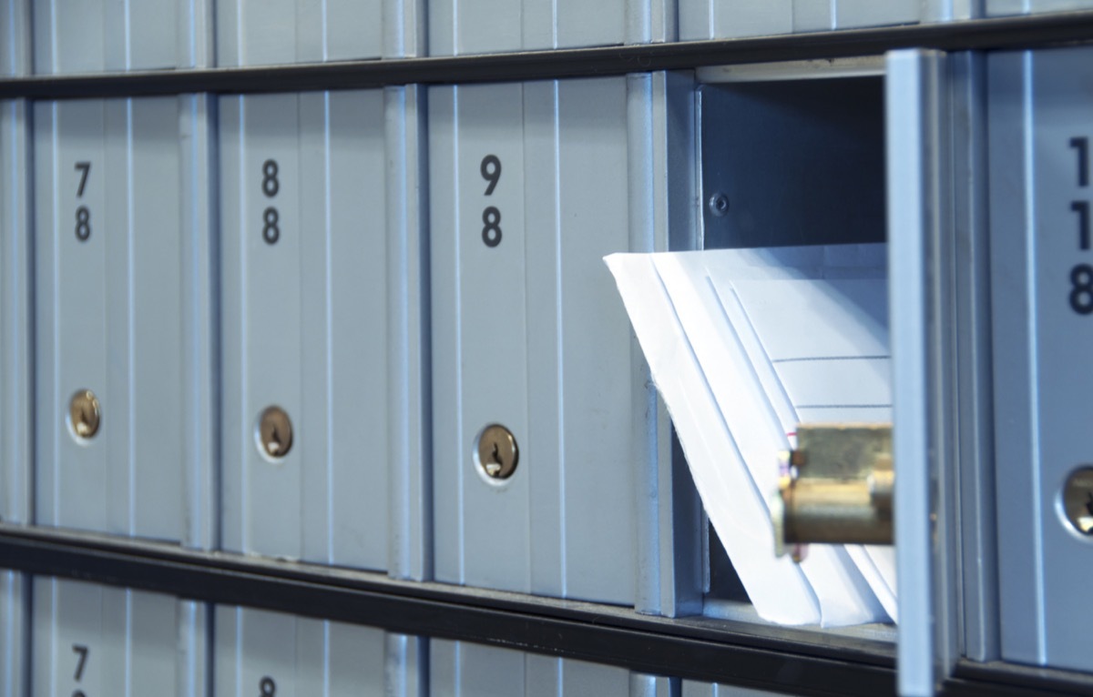 mail waiting in the u.s. grey/blue post office box