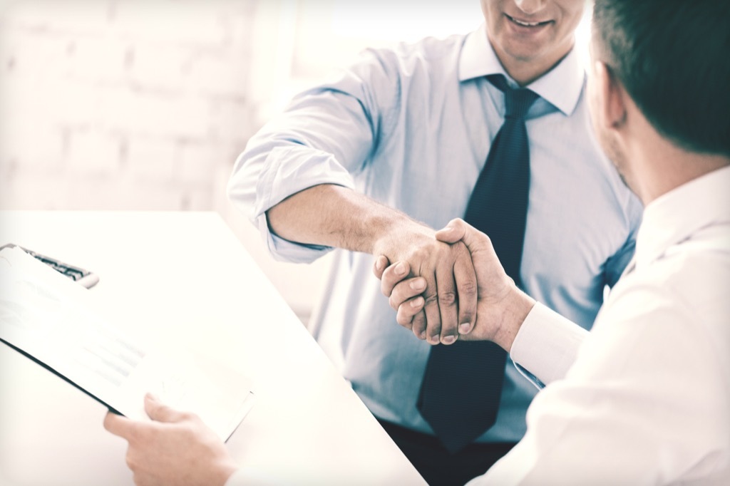 Co-Founder, business partners stressed out handshake