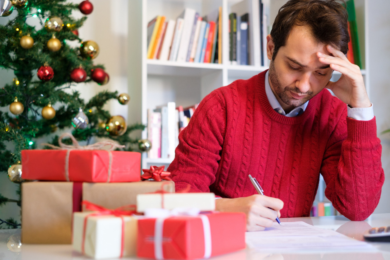 Man during the holidays feeling stressed out. 