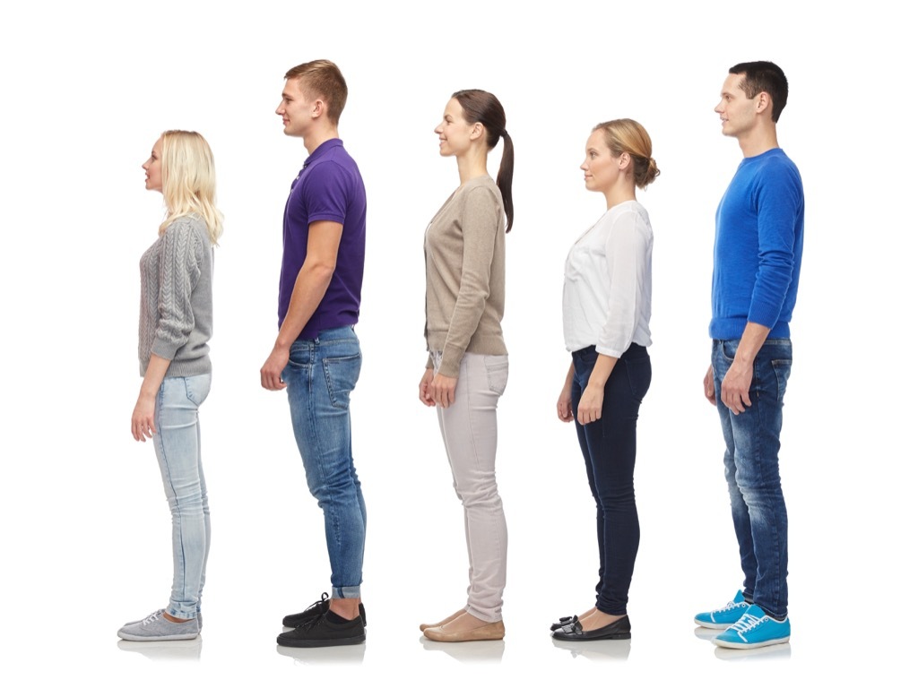 short and tall people standing in a line, ways your body changes after 40