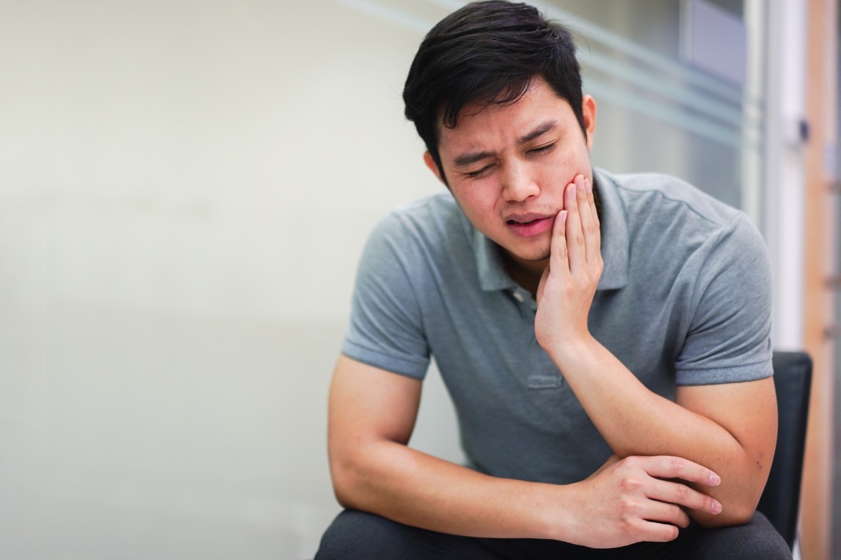 Man experiencing jaw pain