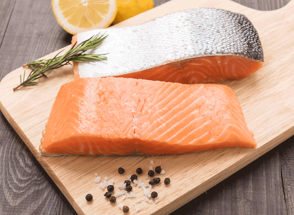 salmon fillets on cutting board with skin