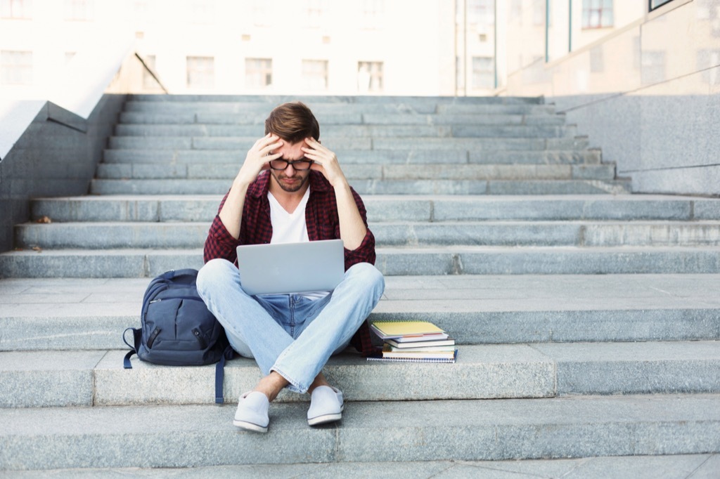 confused college student on the stairs