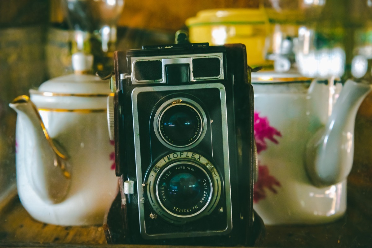 THAILAND, AUGUST 22 2018: Vintage retro Polaroid camera on the wooden table. - Image