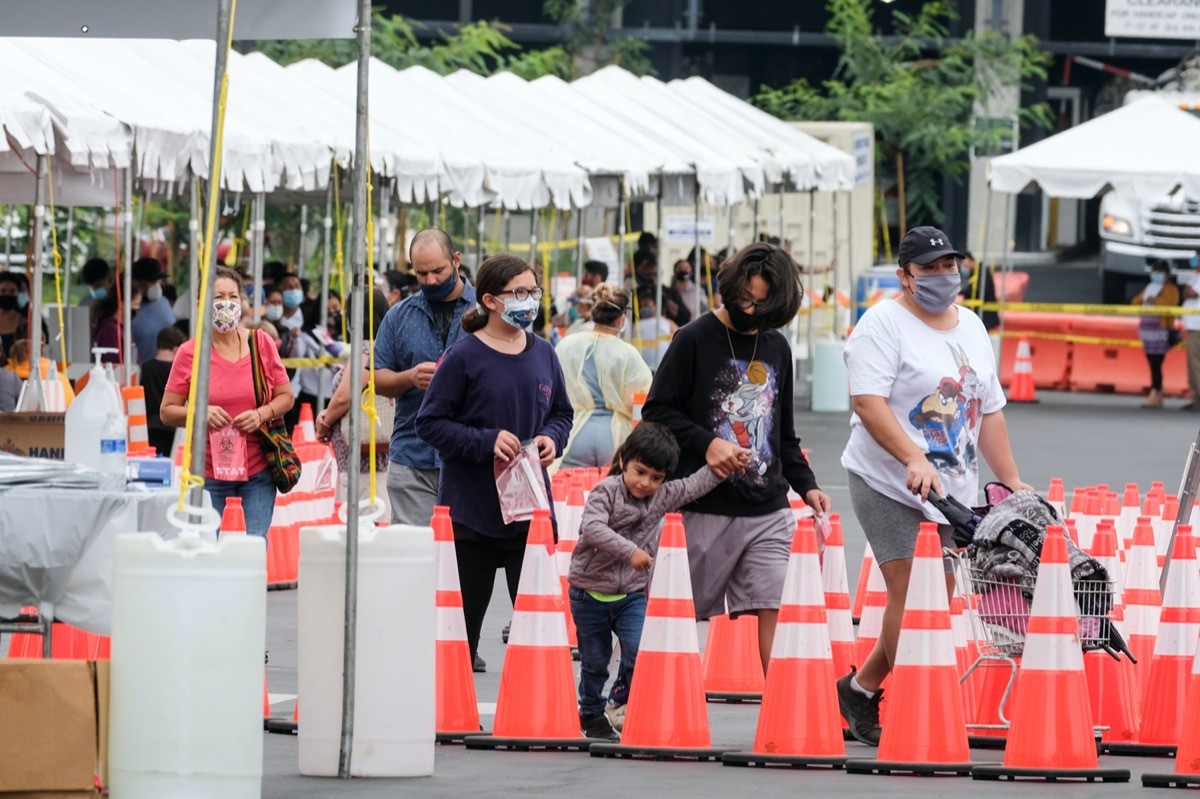 People line up at a mobile Coronavirus testing site at Martin Luther King Jr. Community Hospital