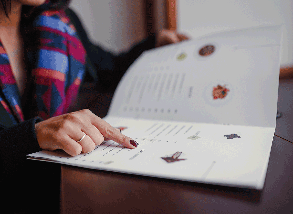 woman pointing and admiring item on menu