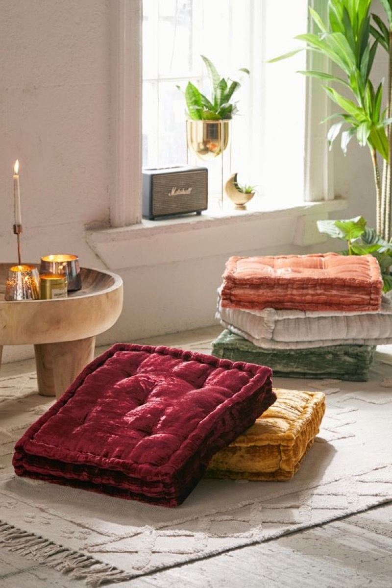 two velvet floor cushions in twee room