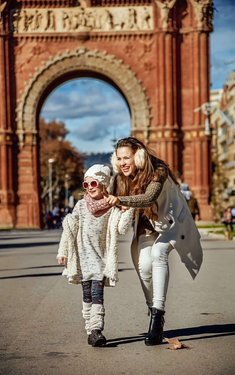 Mother and daughter sightseeing at the Arc de Triomphe