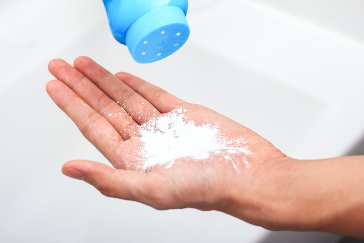 white hand full of talcum powder