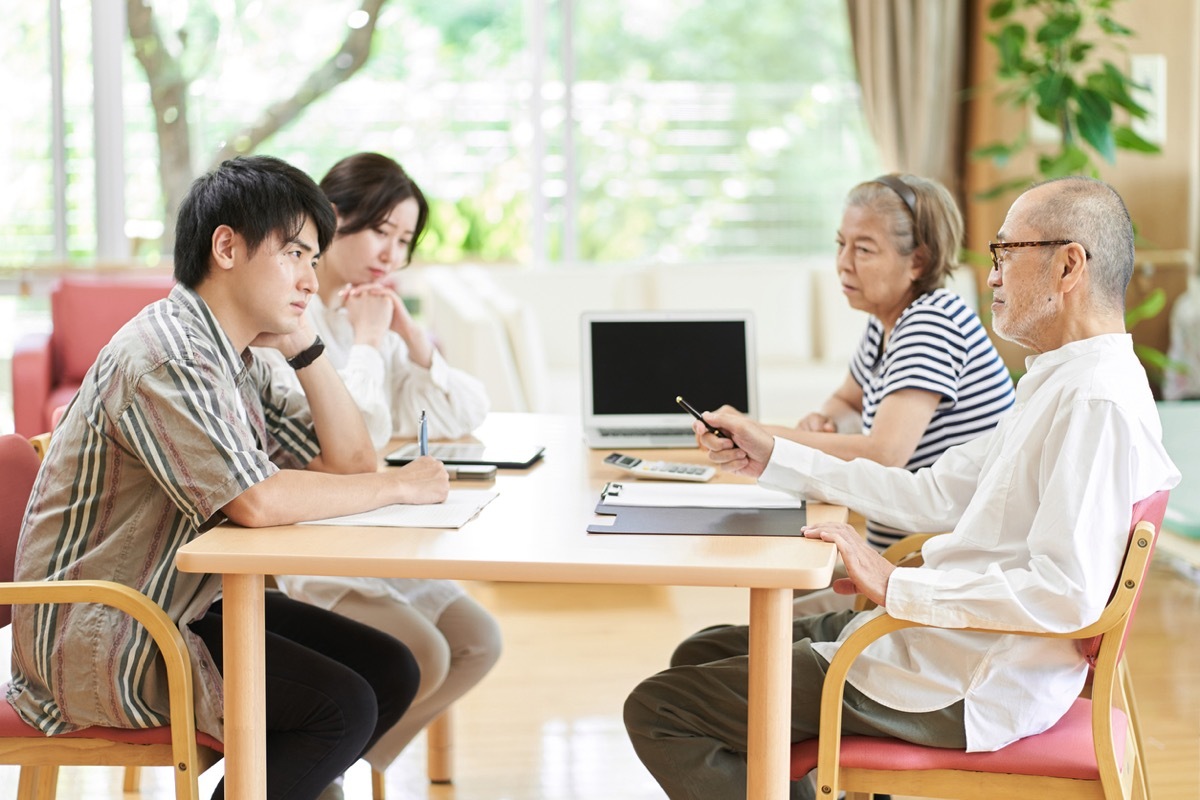 Young couple and old couple quarreling