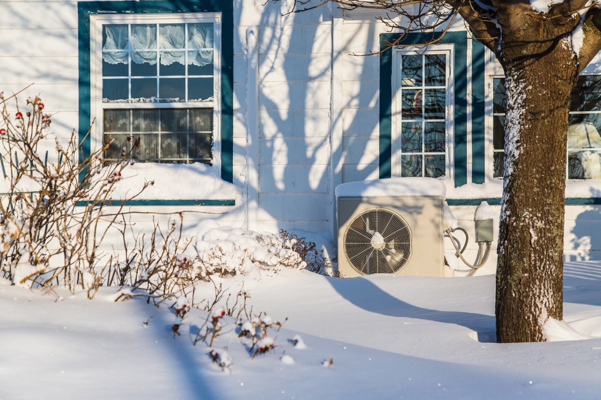 Heat pump on outside of house in winter