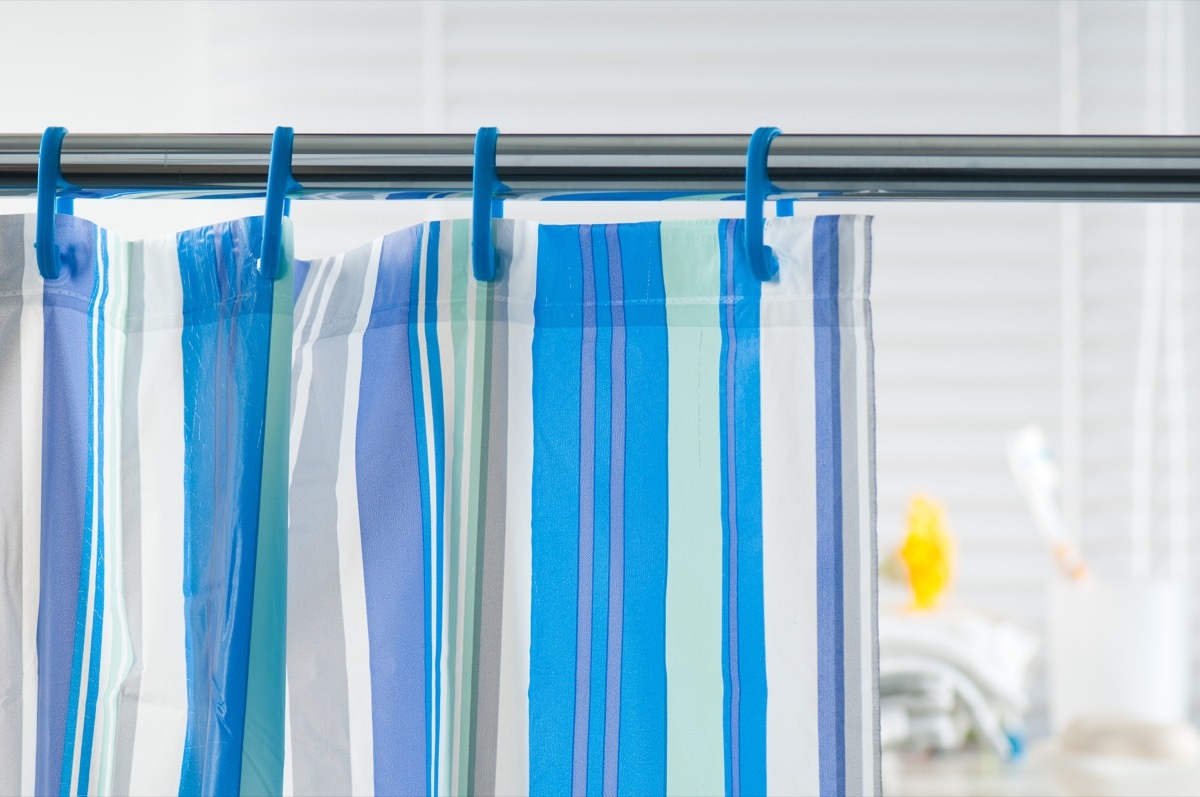 Blue shower curtain in the bathroom