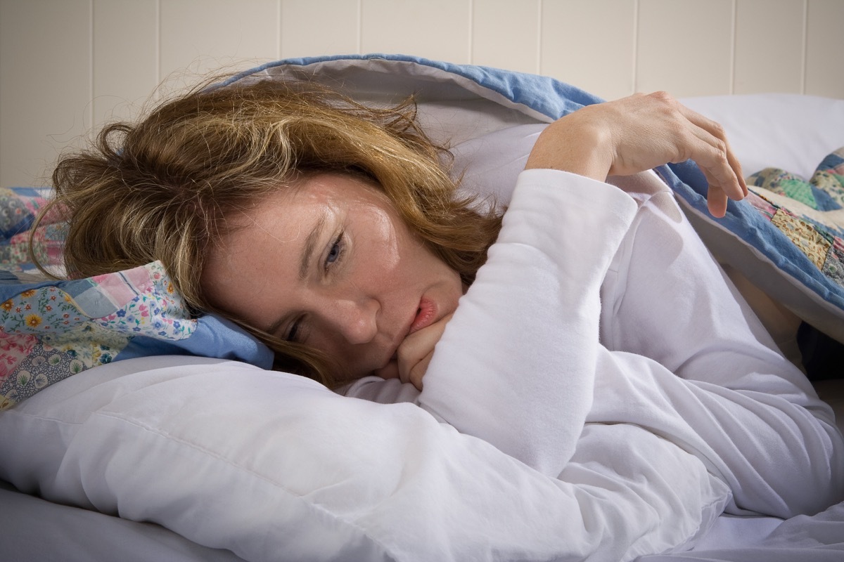 Woman in bed lazy tired sick or depressed