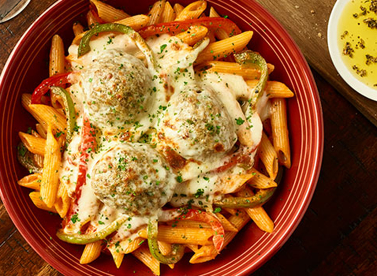 carrabbas penne georgio in red bowl