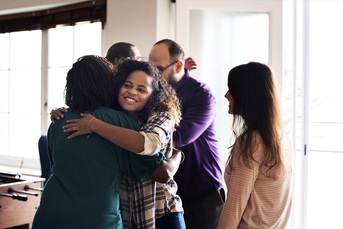 friends and family hugging each other