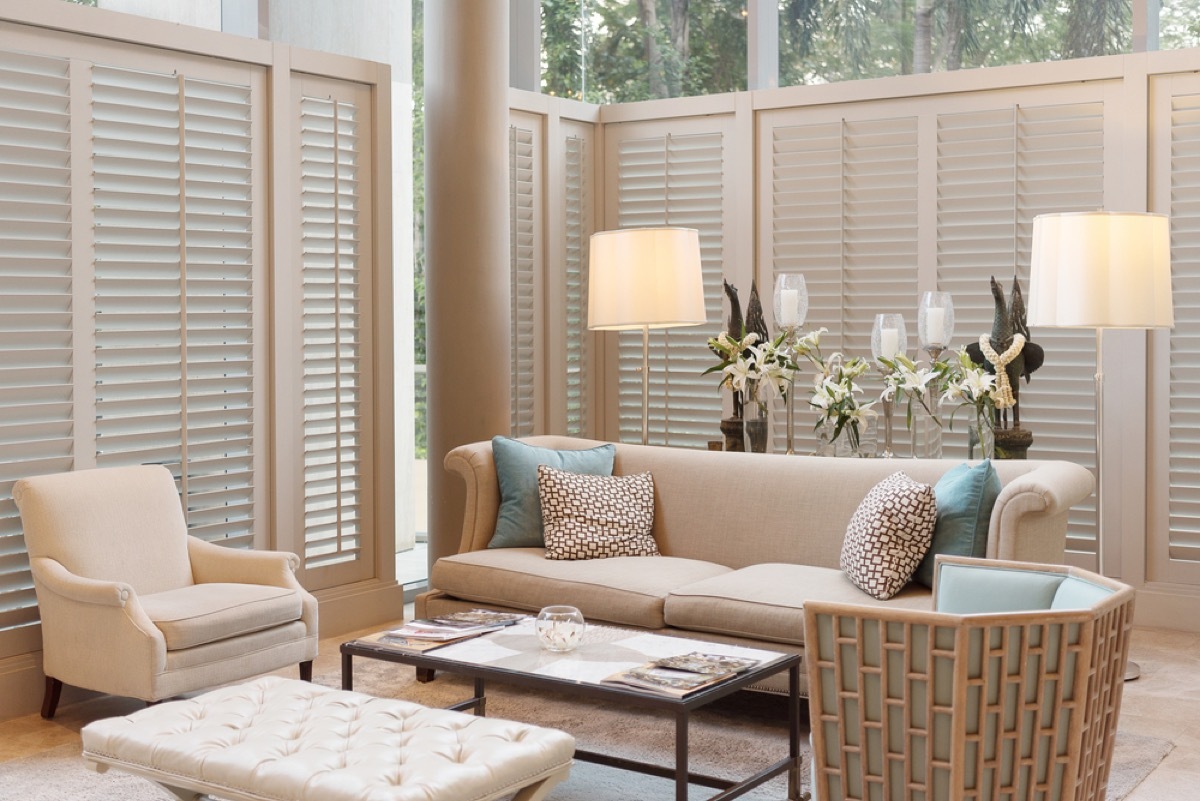 living room with brown couch and earth toned furniture