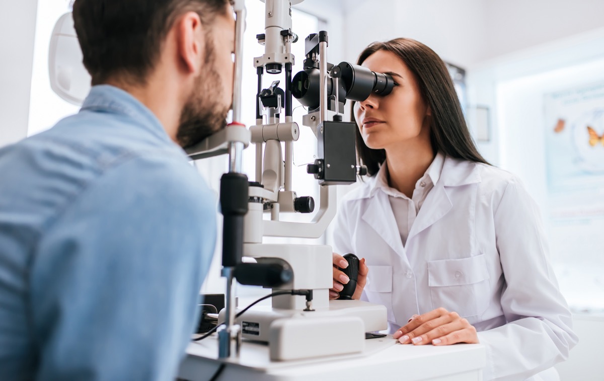 Man getting his eyes checked at the eye doctor