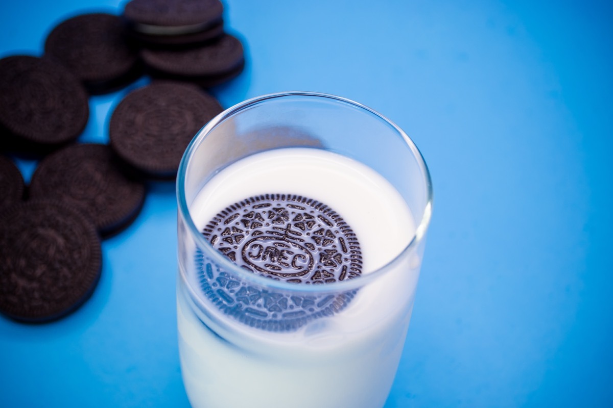 Chocolate Oreo brand cookies are depicted with a glass of milk, smarter facts