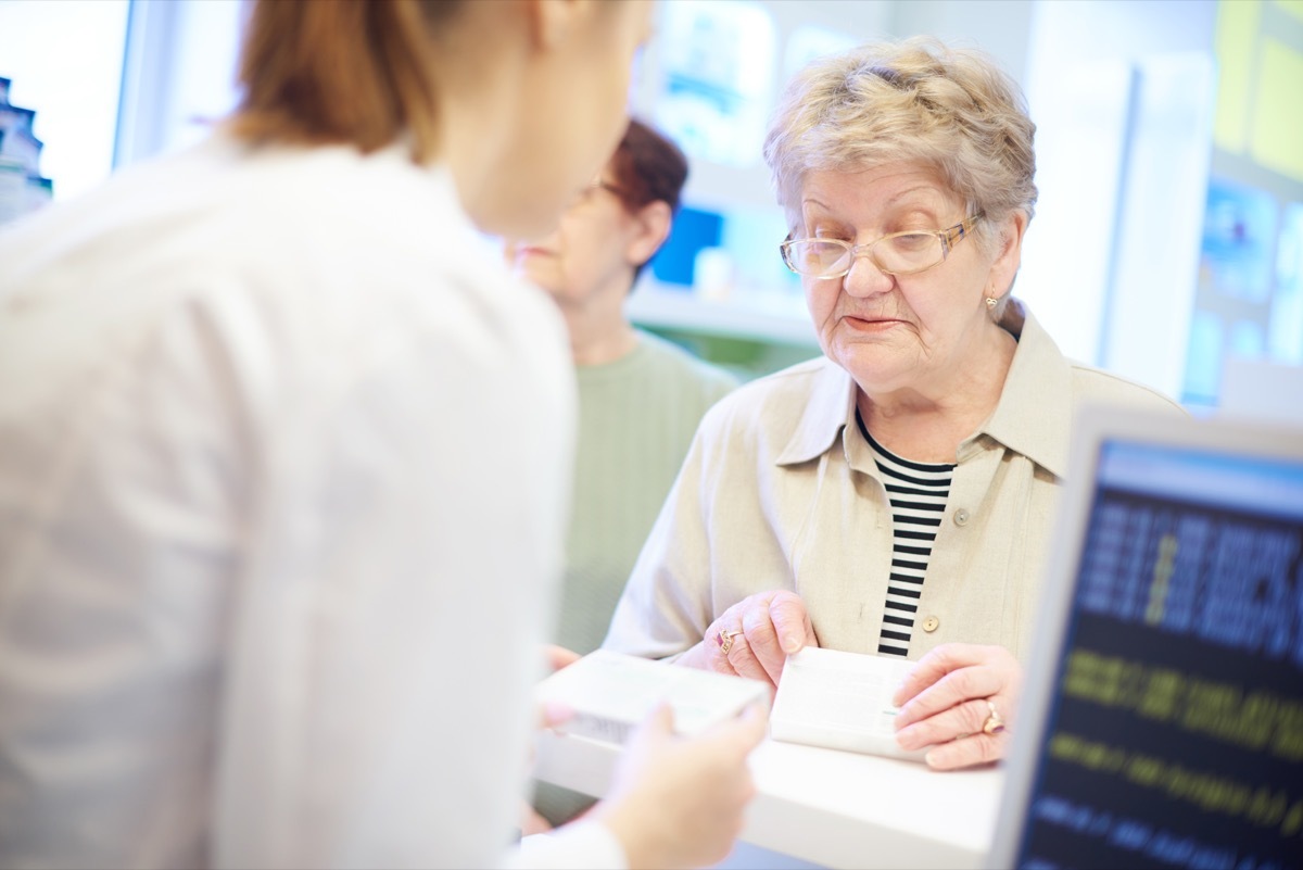 Senior checking out at the register