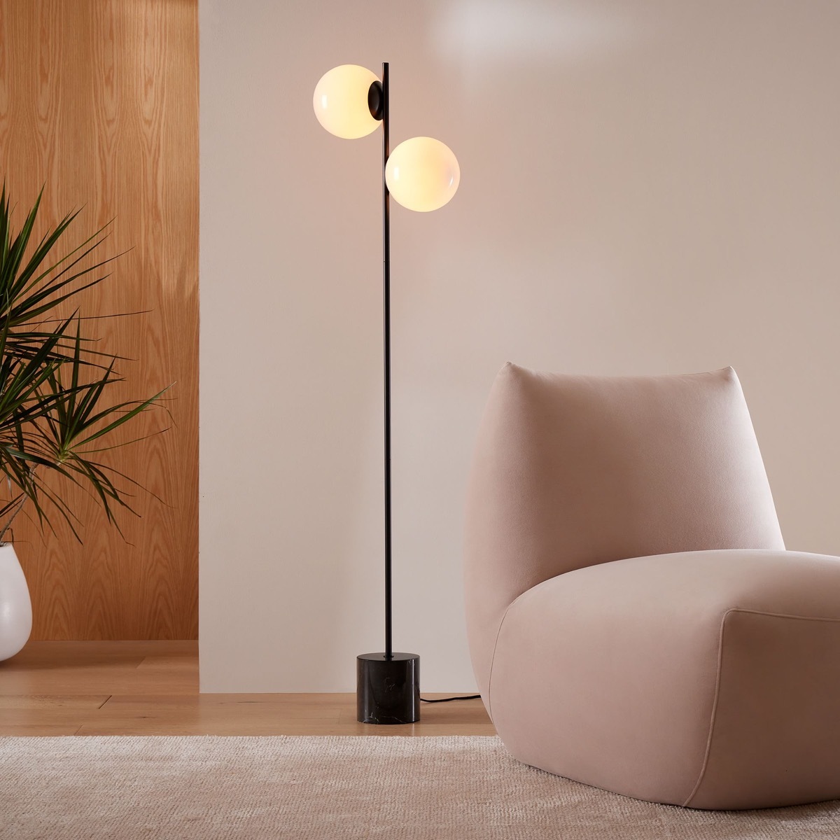 A West Elm Sphere floor lamp in a matte black finish