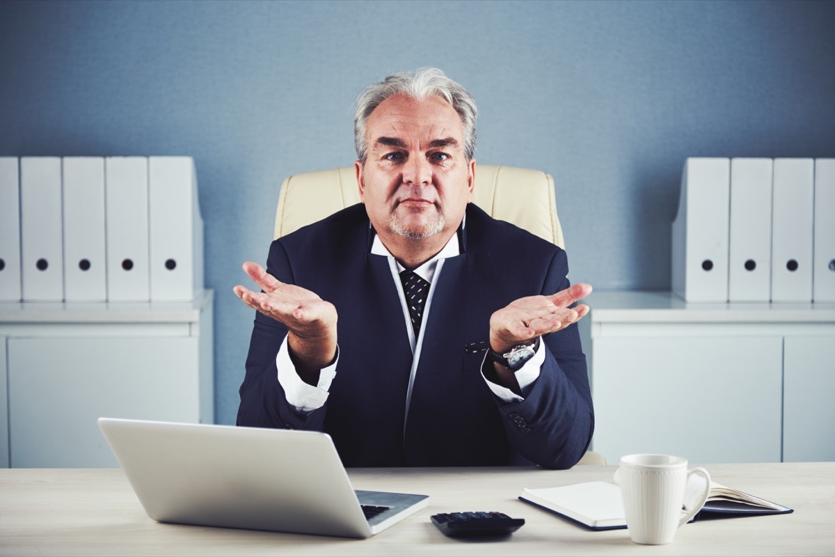 old man confused by laptop