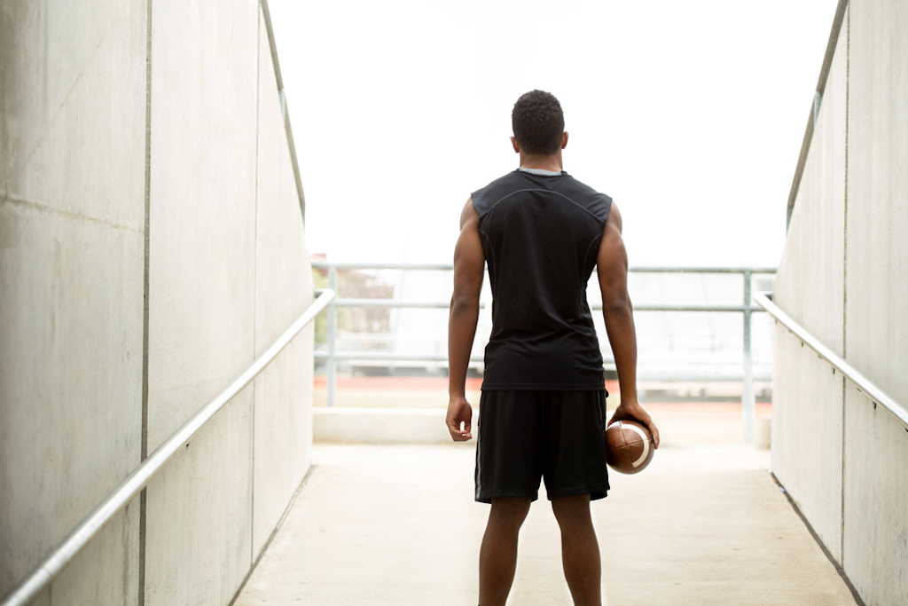 college athlete playing football