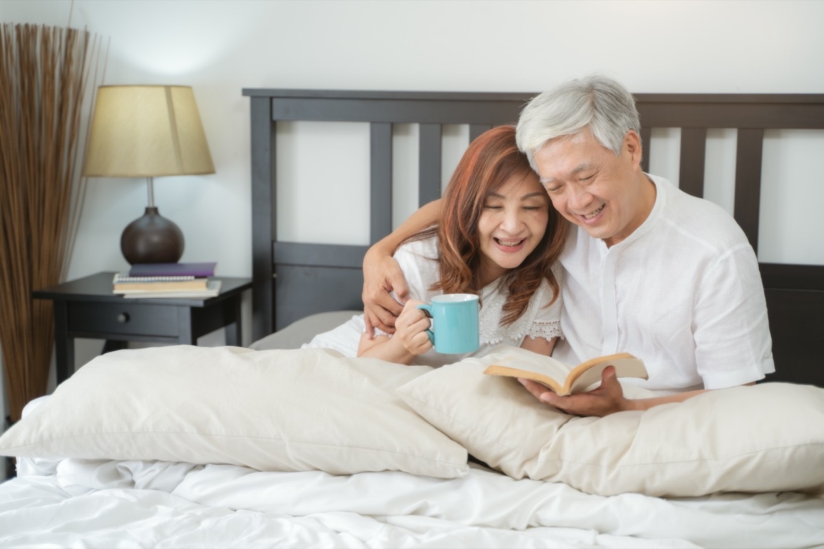 couple reading a book in bed