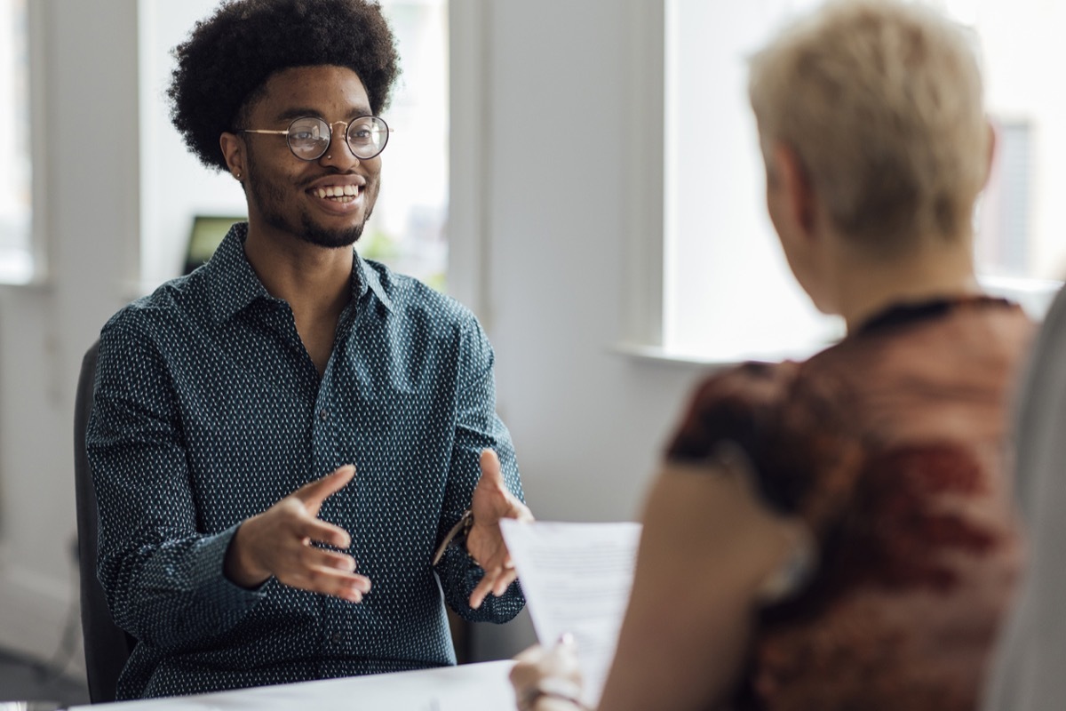 male candidate giving an answer to a question during a job interview