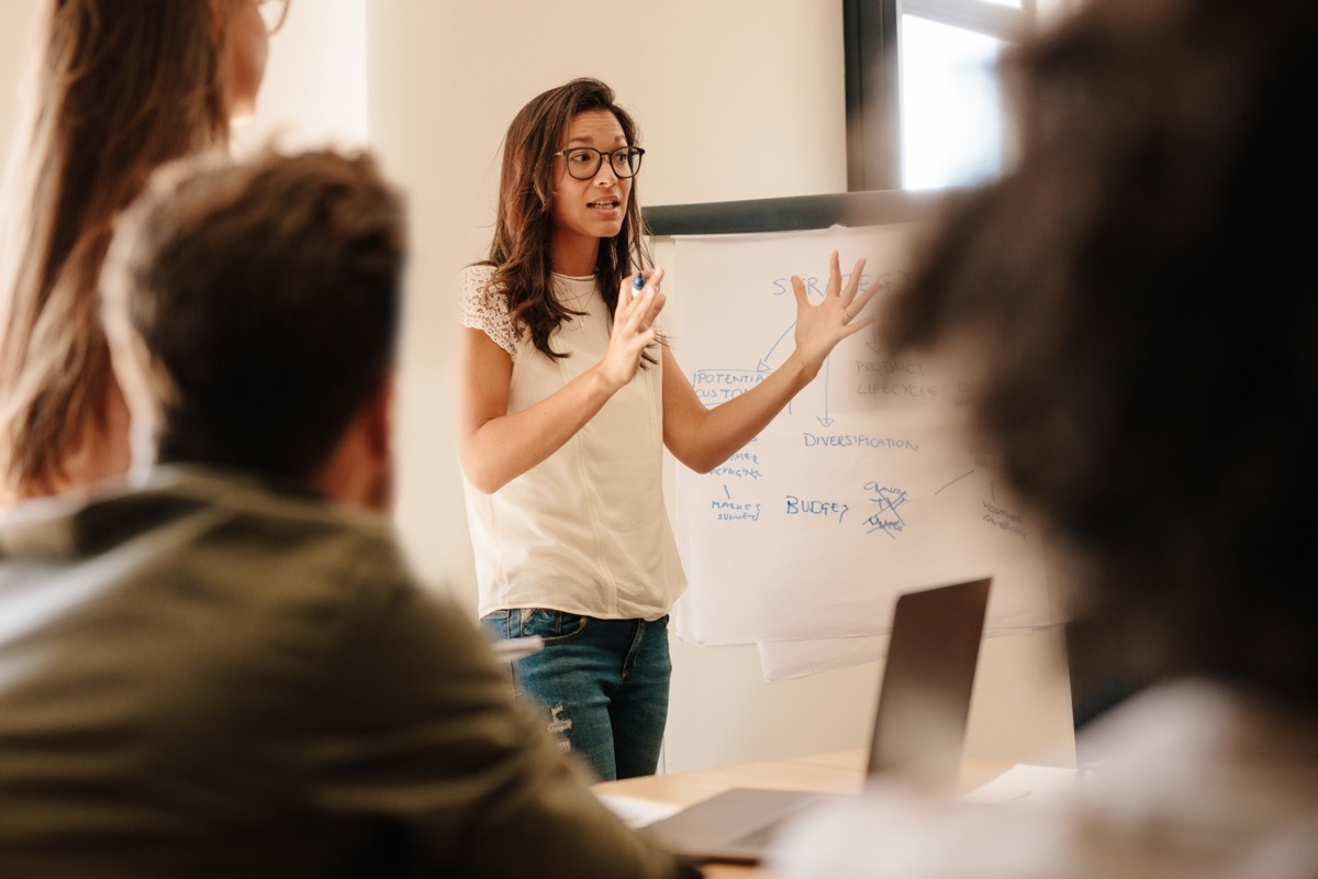 woman leading group in conference room