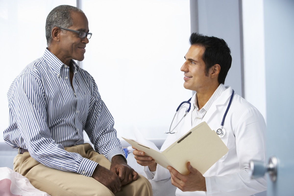 Older man getting checked out at the doctor's office