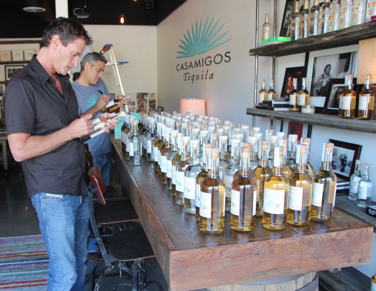 rande gerber and george clooney with casamigos tequila bottles