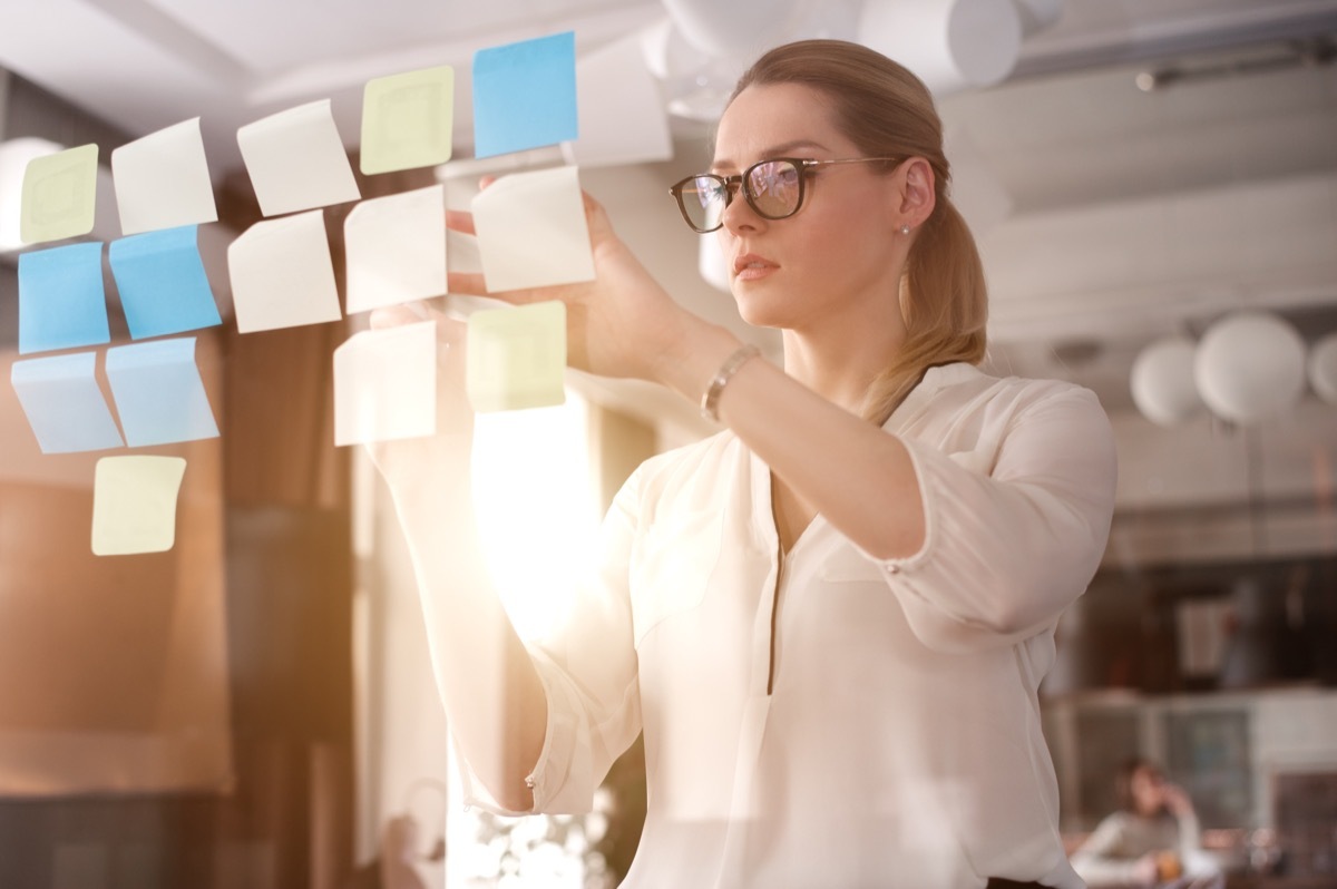 Young Woman Planning with Post-Its