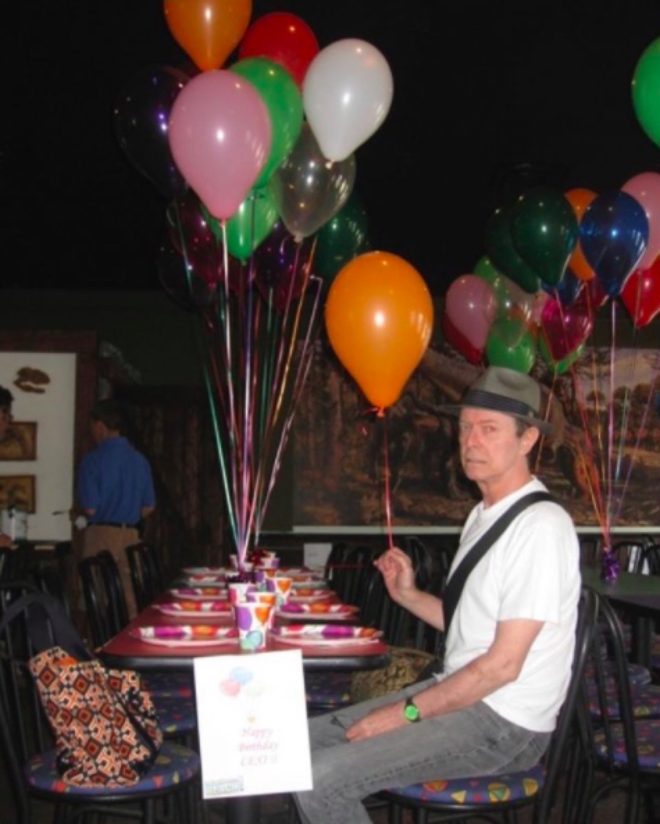 David Bowie holding a birthday balloon