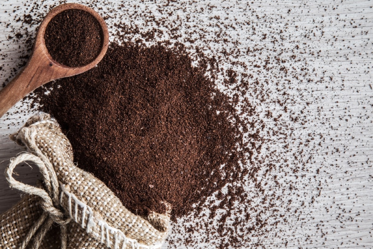 coffee grounds and wooden spoon