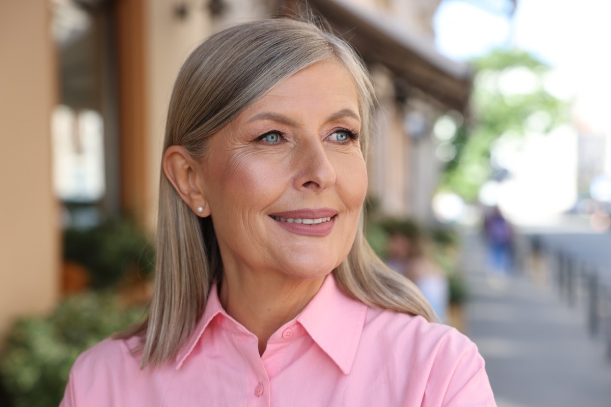 Portrait of beautiful happy senior woman outdoors