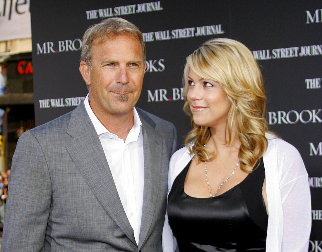 Kevin Costner and Christine Baumgartner at the premiere of 