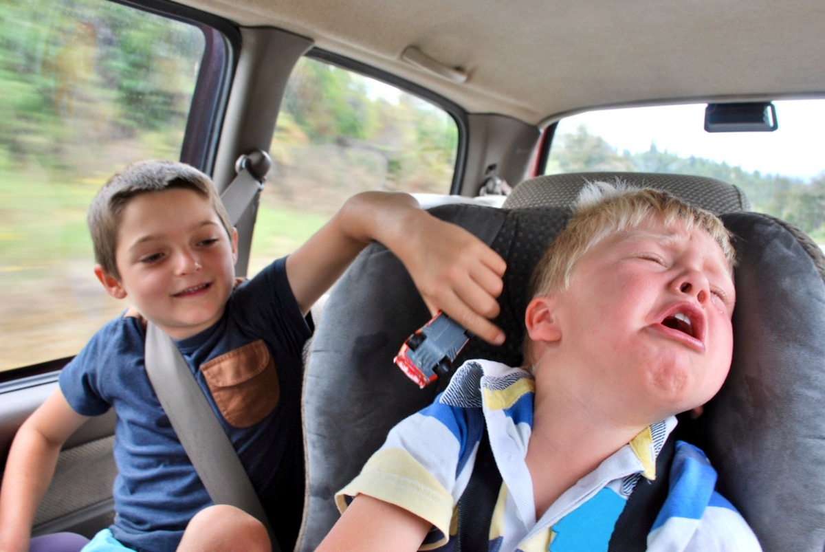 Kids Fighting During a Road trip 1990s Parents