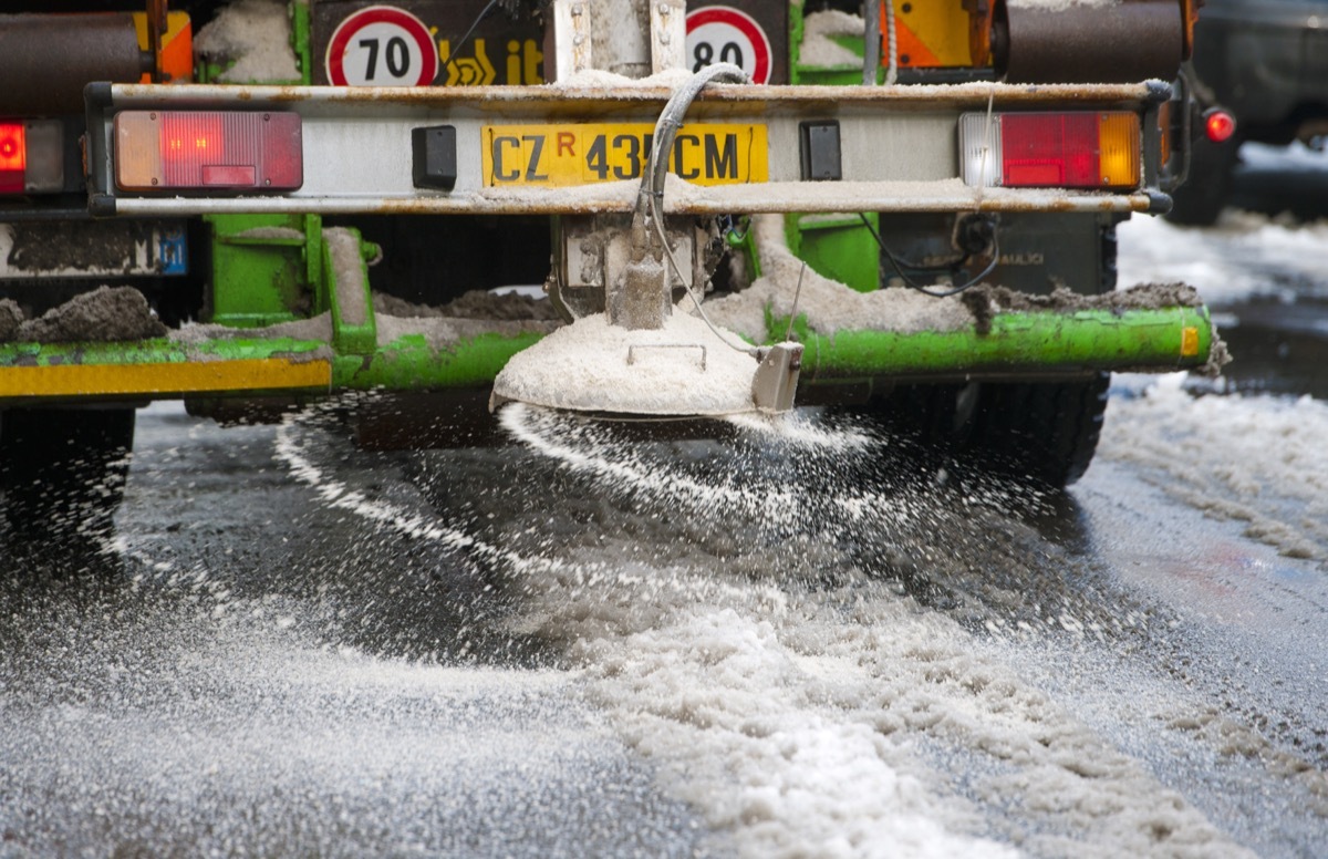 salt truck on icy road