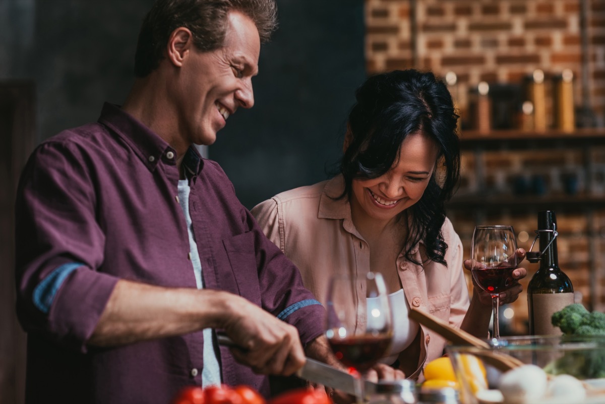 man and woman cooking in a brick-walled kitchen, better wife over 40