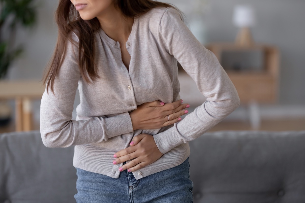 Woman Holding Her Stomach in Pain