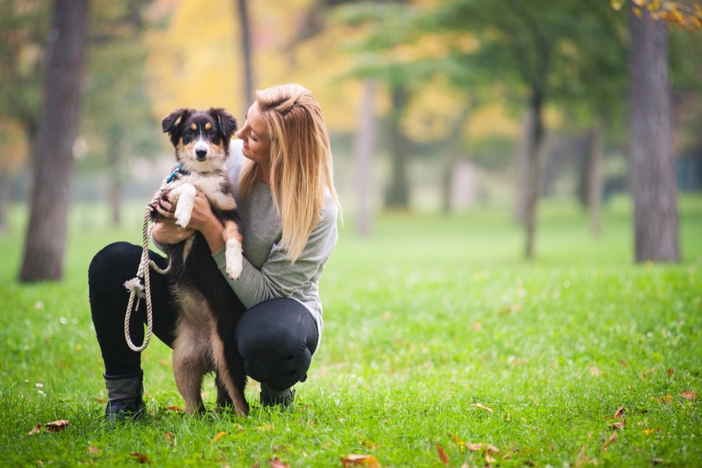 Woman with dog in park