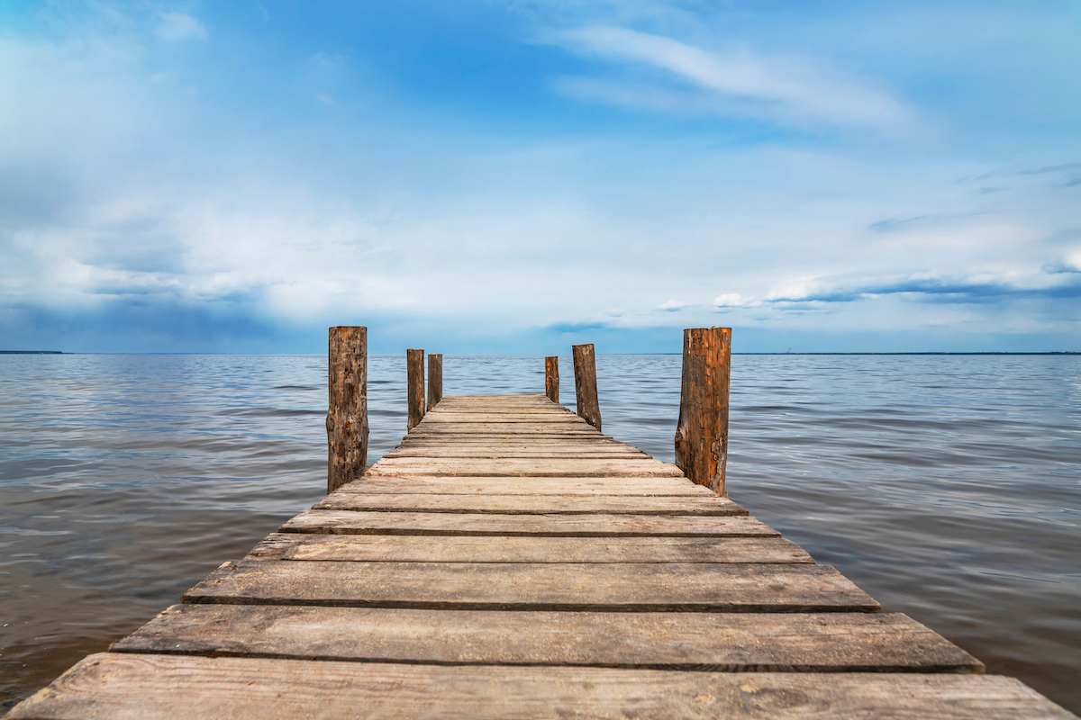 Perspective view of wooden pier on ocean