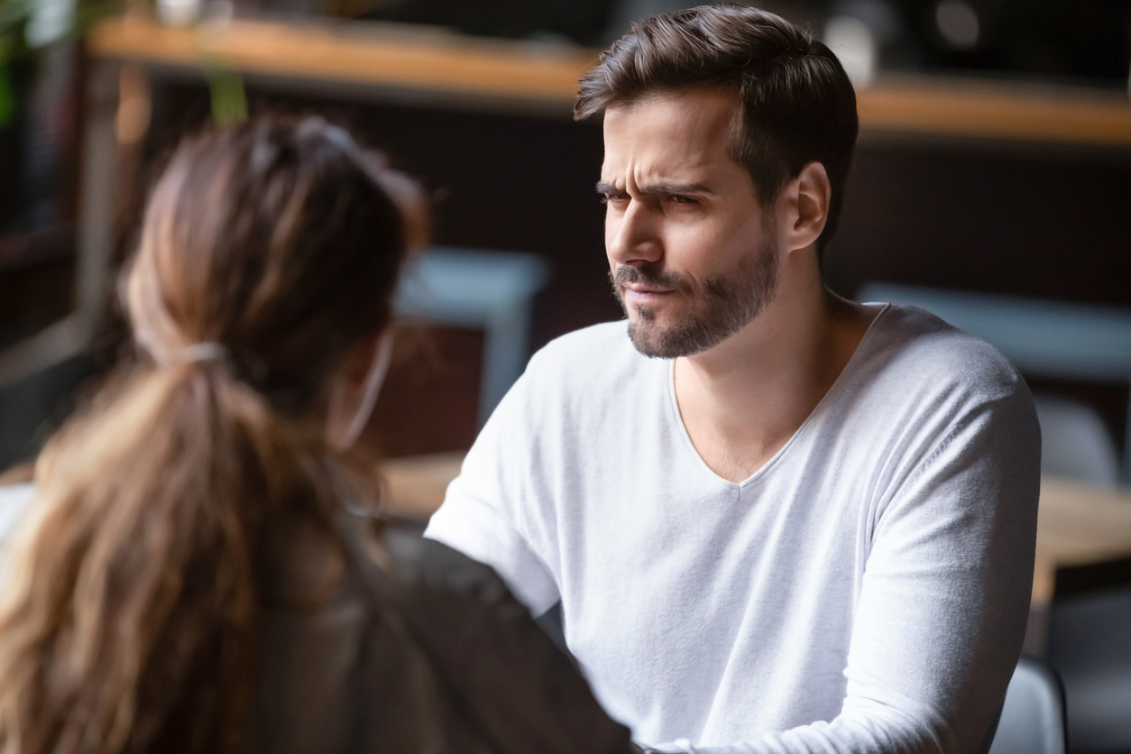 Doubting dissatisfied man looking at woman, bad first date