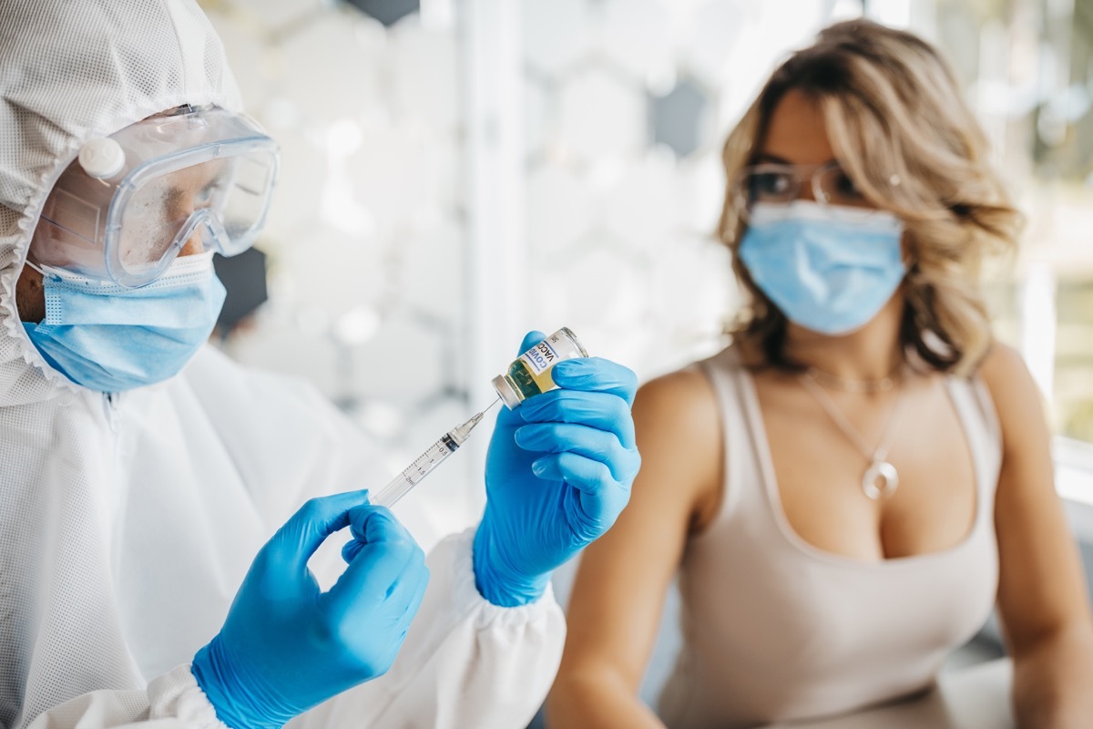 Woman getting COVID vaccine