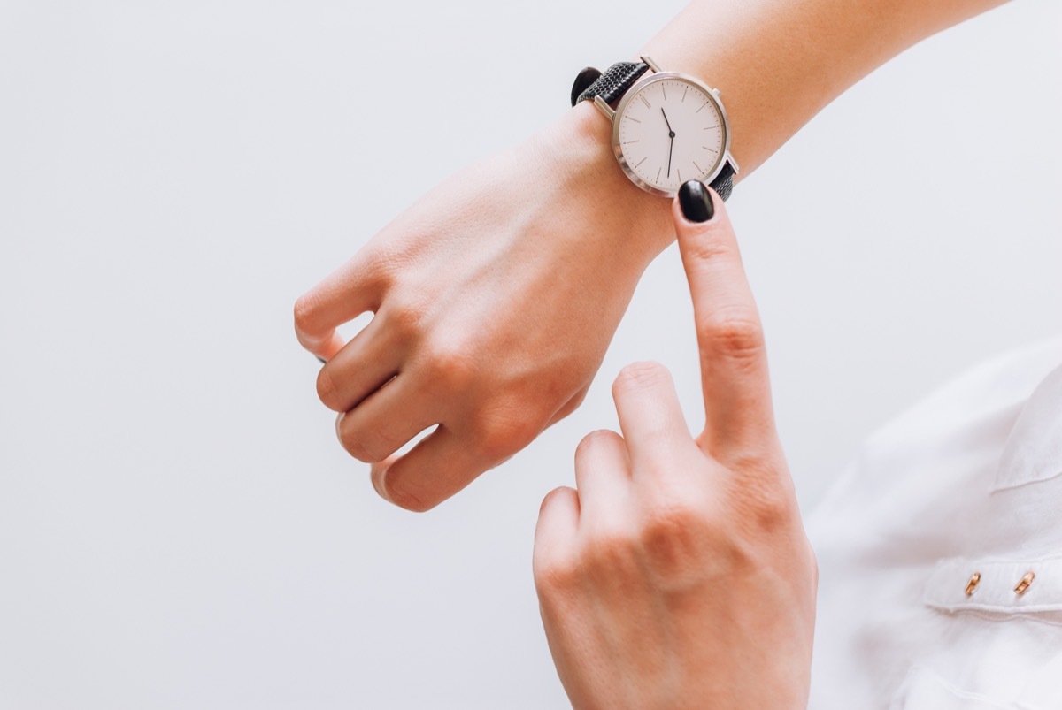 Woman looking at her watch