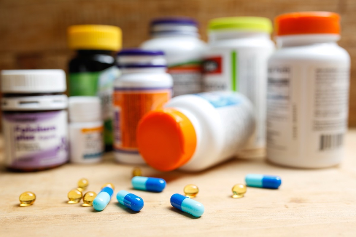 pill bottles and loose pills on counter