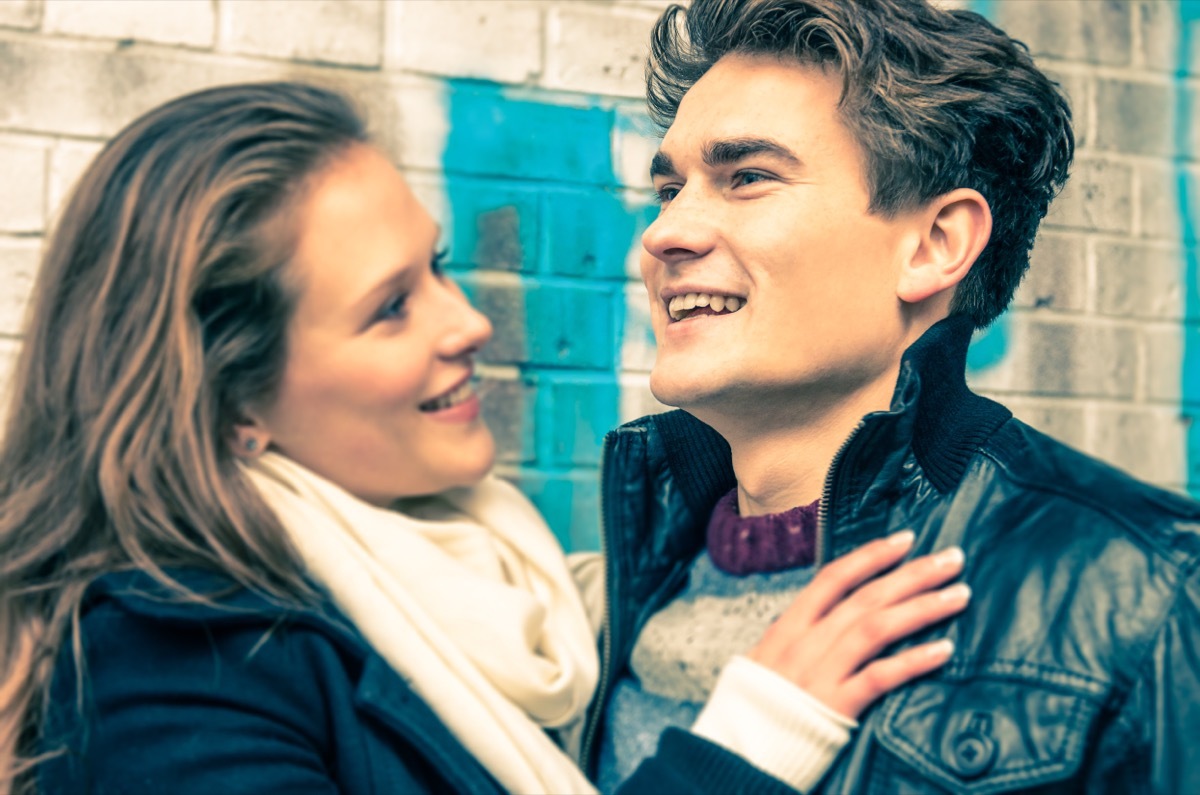 woman with her hand resting on her boyfriend's chest