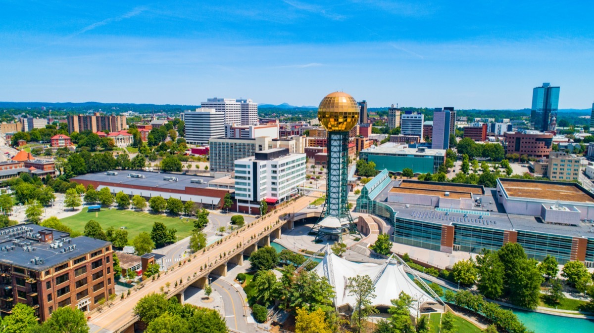 cityscape photo of buildings, a highway, and the Sunsphere in Knoxville, Tennessee