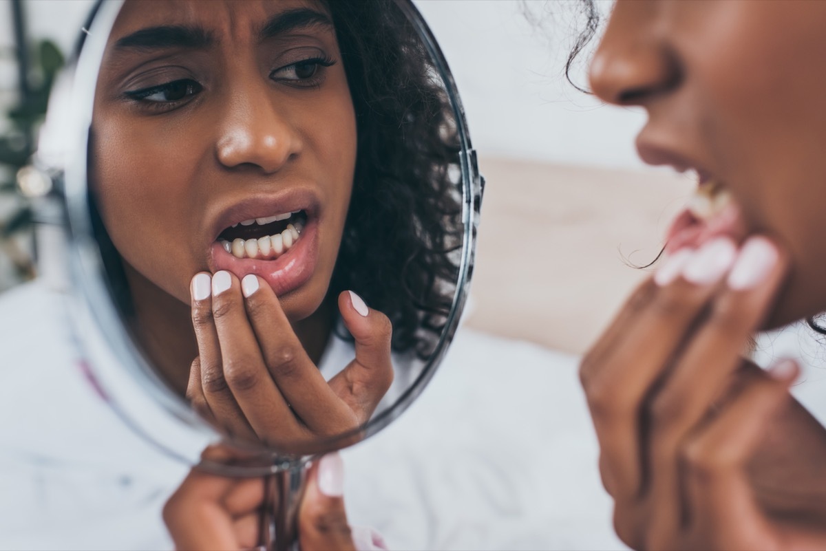 Woman looking at her teeth